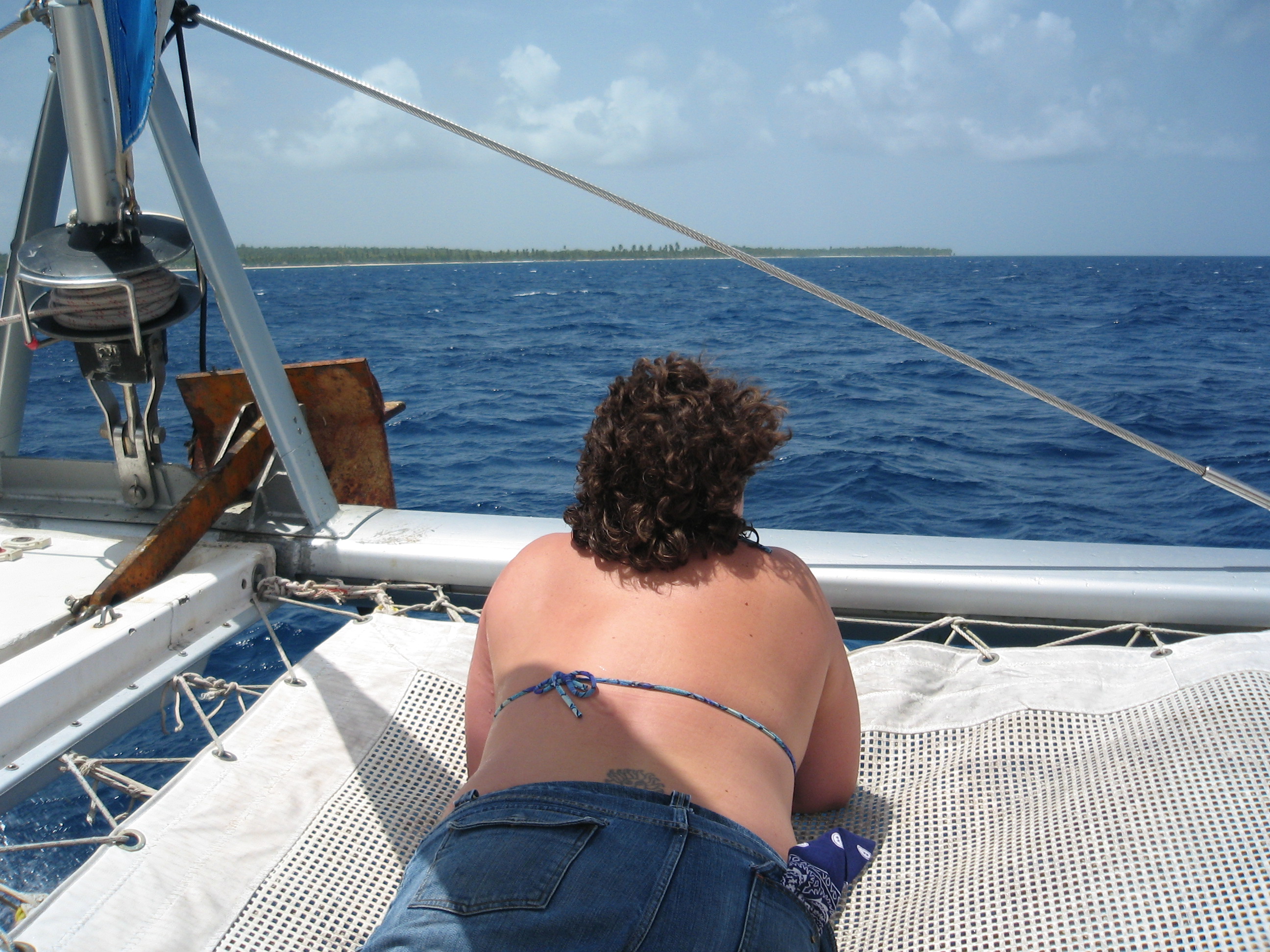 Katie on the net at the front of the Catamaran