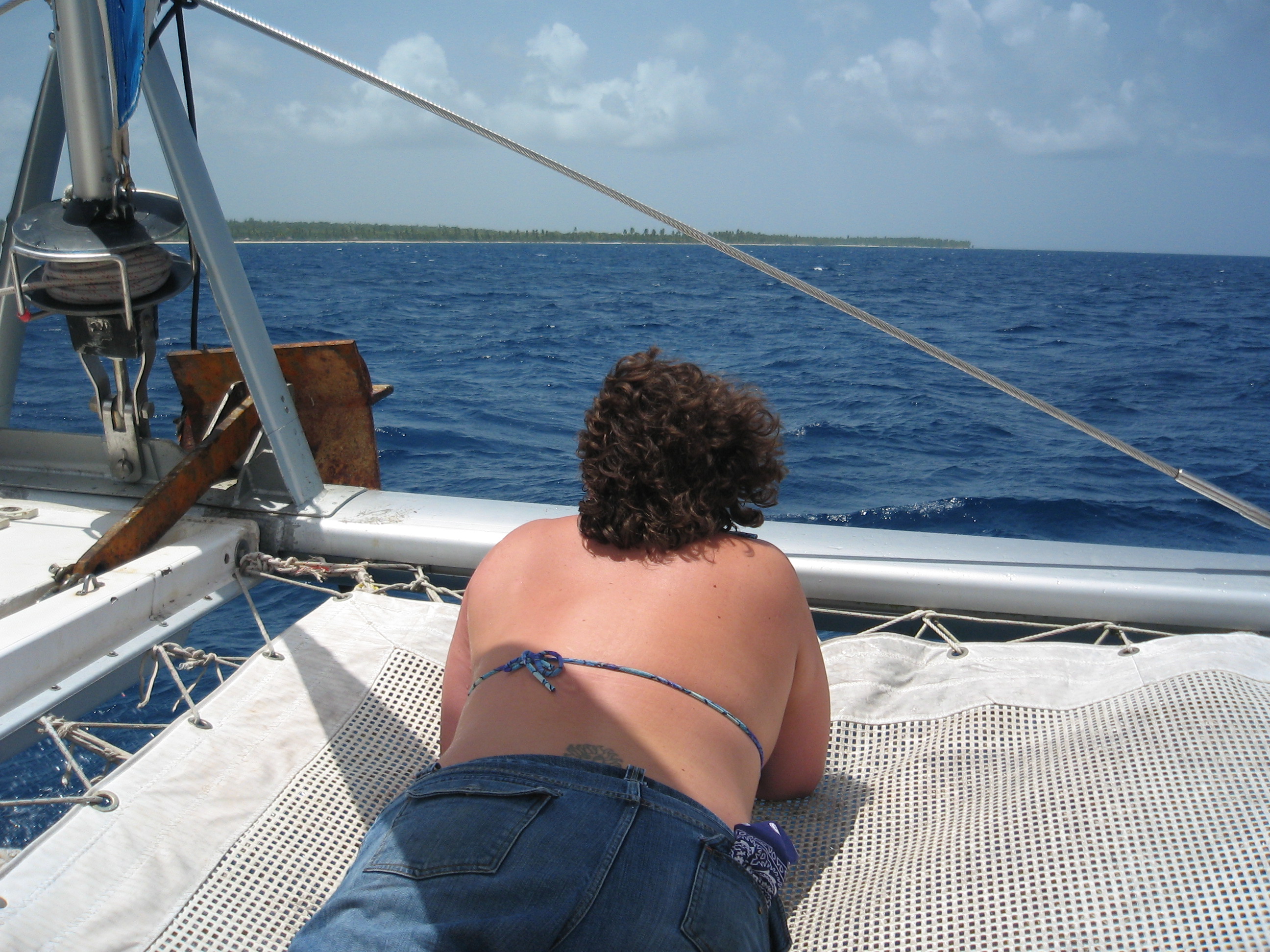 Katie on the net at the front of the Catamaran