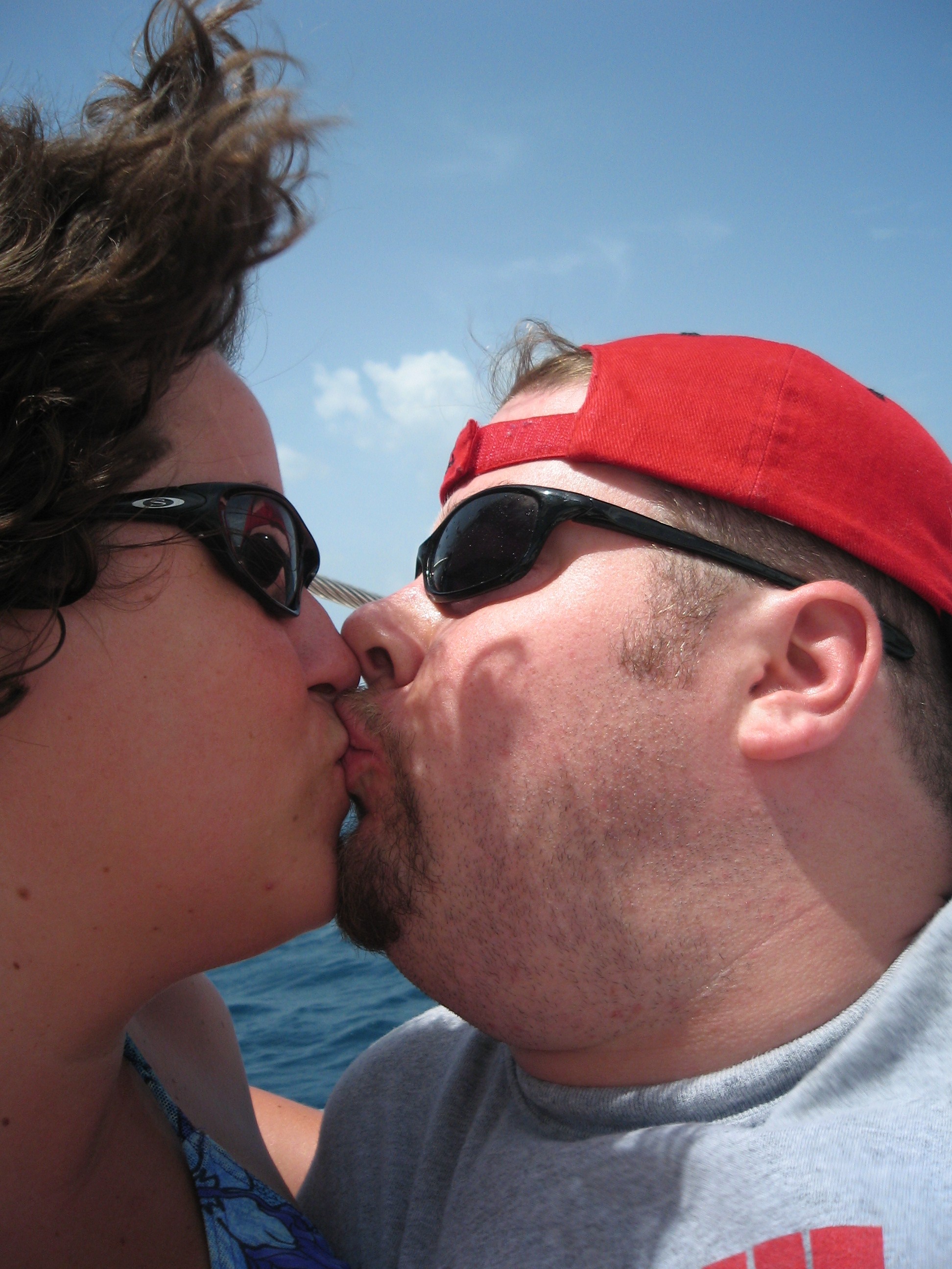 BJ and Katie kiss on the Catamaran