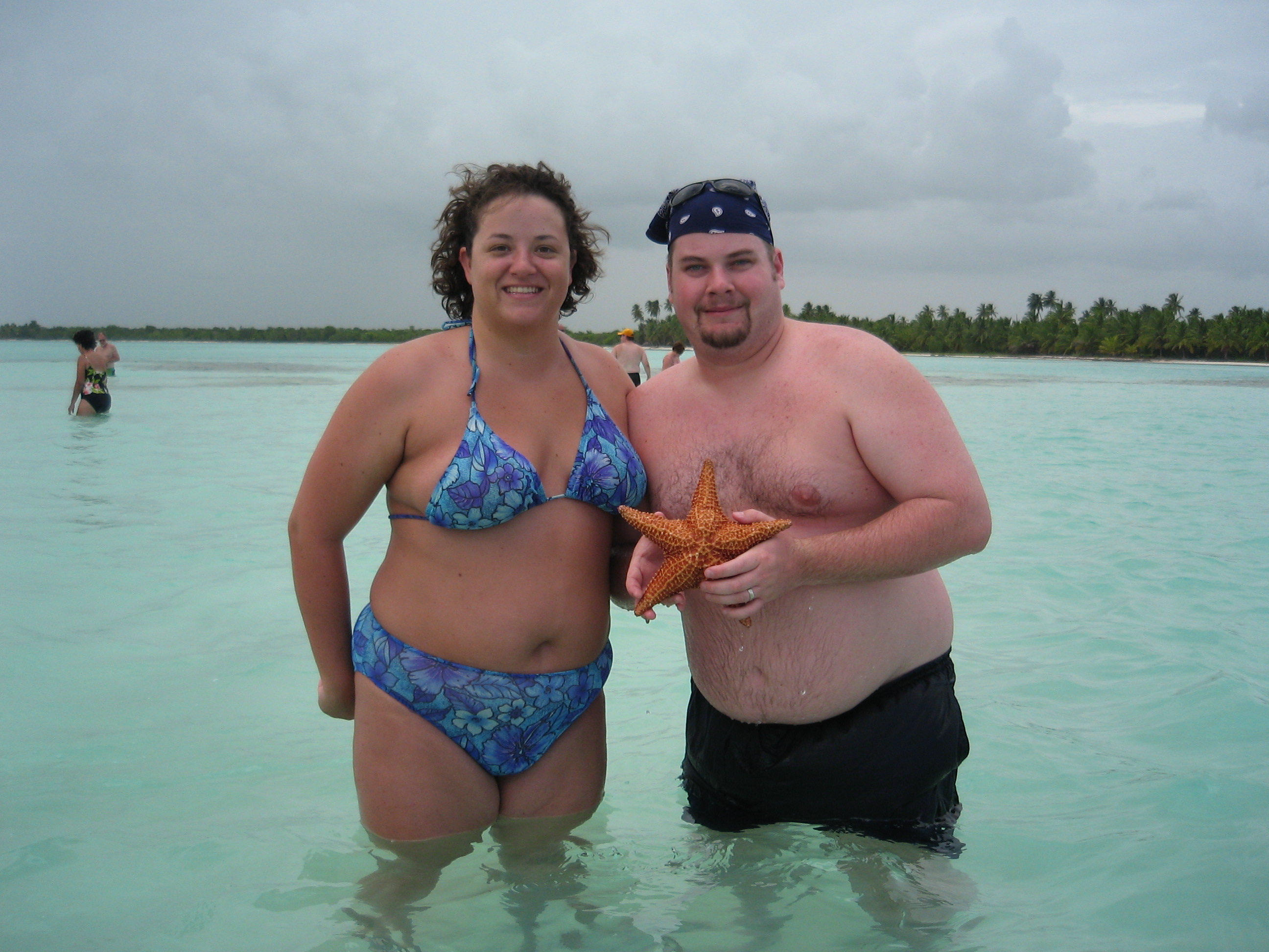 BJ and Katie with a starfish in the natural swimming pool